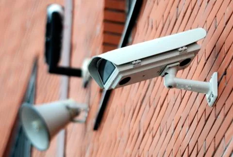 Security camera on the wall Stock Photos