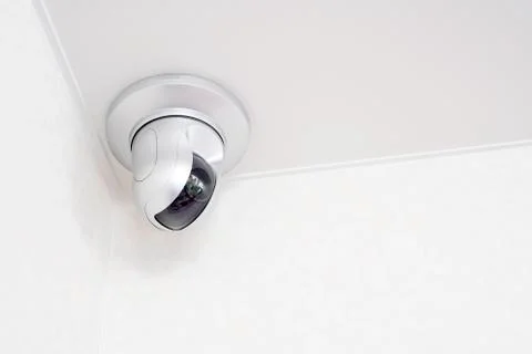 Security camera on white ceiling Stock Photos