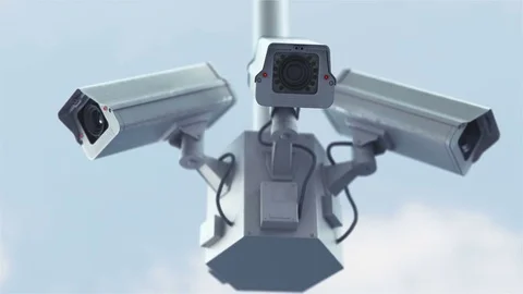Security cameras against blue sky in 4K 스톡 동영상 77154238