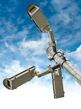 Security cameras on blue sky background Stock Photos
