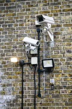 Security Cameras On Brick Wall Stock Photos