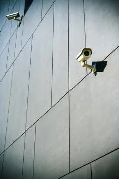 Security cameras on dark building Stock Photos