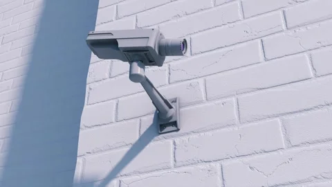 Security cameras look around and study the viewer, focusing on him Stock Footage 253486623