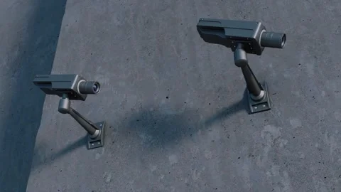 Security cameras look around and study the viewer, focusing on him Stock Footage 254025575