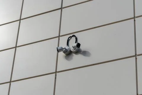 Security cameras observing building facade ensuring safety and surveillance Foto stock