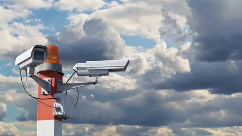 Security cameras on pillar against the cloudy sky Video stock 132103881