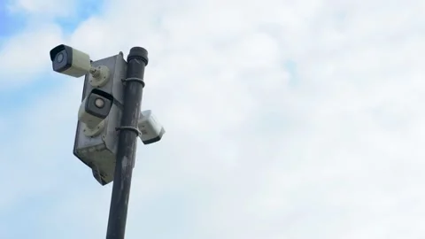 Security Cameras on a Pole with Clouds in the Background (tilt up shots) Stock Footage 238378823