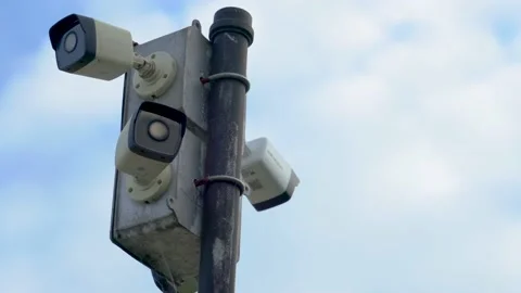 Security Cameras on a Pole with Clouds in the Sky (close-up tilt up shots) Stock Footage 238373136