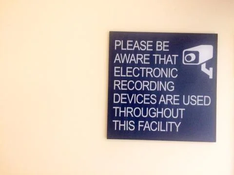 Security cameras in use sign Stock Photos