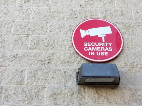 Security cameras in use sign warning electronic devices are in use Stock Photos