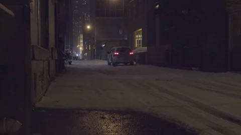 Security car parked in a dark winter alley Stock Footage 85401290