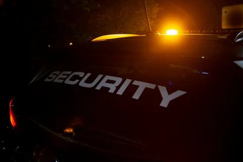 Security car patroling at construction site at night  city Stock Photos