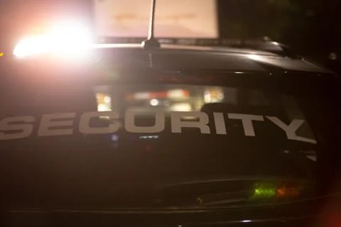 Security car patroling at construction site at night  city Stock Photos