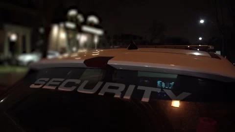 Security car is stationed at commercial facilities at night to watch out for car Видео 260738475