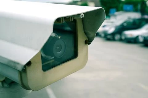 Security CCTV camera in car park, shallow depth of field, filter effect Stock Photos