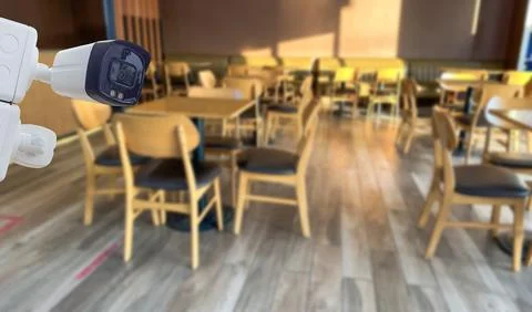 Security CCTV camera installed in coffee shop Stock Photos