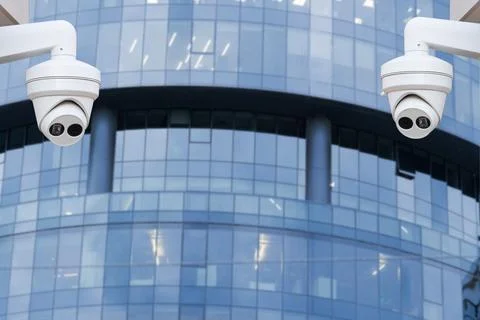 Security CCTV camera in office building. Blurred background. Stock Photos