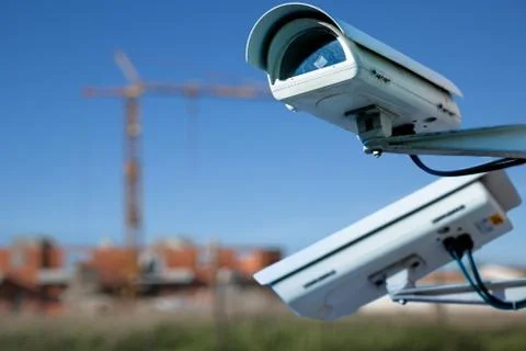 Security CCTV camera or surveillance system with construction site on blurry  Stock Photos