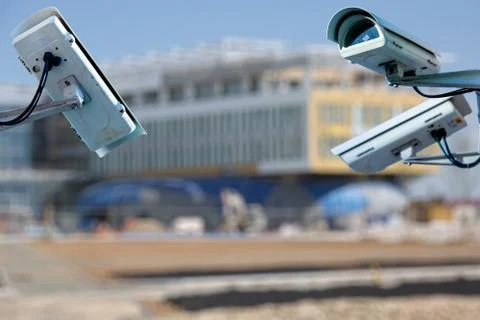 Security CCTV camera or surveillance system with construction site on blurry  Stock Photos