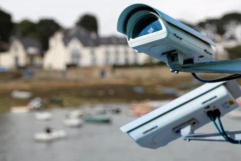 Security CCTV camera or surveillance system with Marina on blurry background Stock Photos