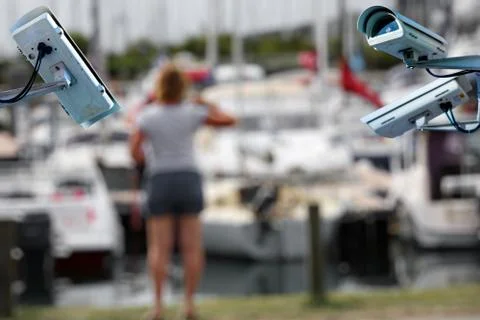 Security CCTV camera or surveillance system with Marina and woman on blurry b Stock Photos