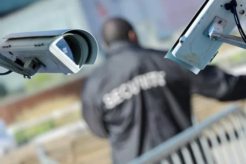 Security CCTV camera or surveillance system with vigil on blurry background Stock-Fotos