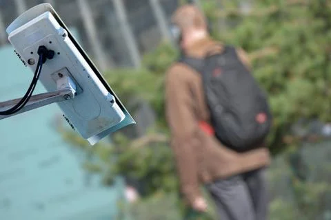 Security CCTV camera or surveillance system with man on blurry background ... Stock Photos