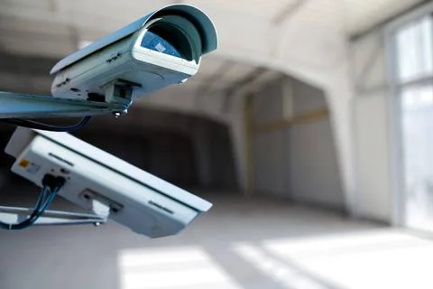 Security CCTV camera or surveillance system with construction site on blur... Stock Photos