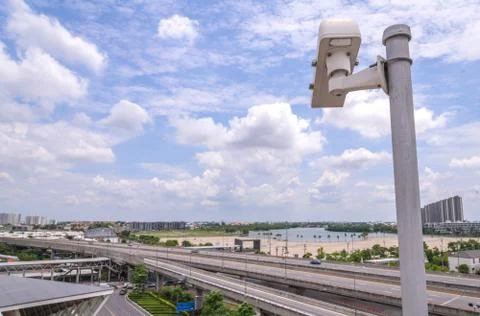 Security CCTV camera on road in city Stock Photos