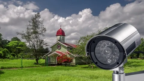 Security CCTV camera system with church or cathedral on blurry background Stock-Footage 82956837
