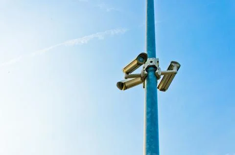Security cctv cameras on blue sky Stock Photos