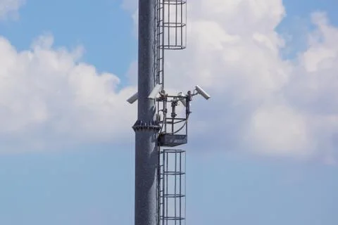 Security cctv cameras on a pole with blue sky background Stock Photos
