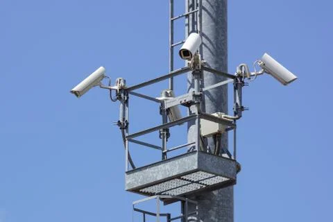 Security cctv cameras on a pole with blue sky background Stock Photos