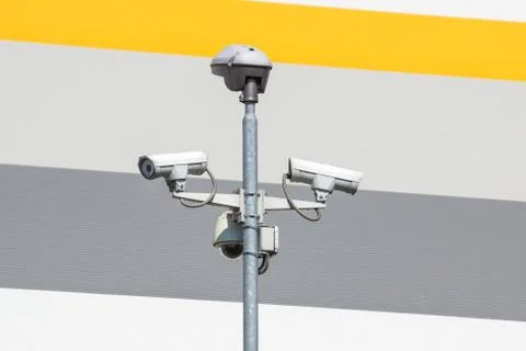 Security cctv cameras on a pole with blue sky background Stock Photos