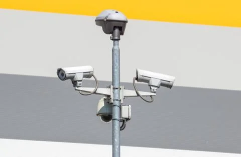 Security cctv cameras on a pole with blue sky background Stock Photos