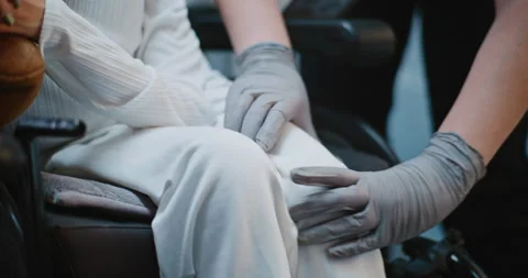 Security Checkpoint: Female TSA Officer Checking Woman with Physical Disability Stock Footage 307116516