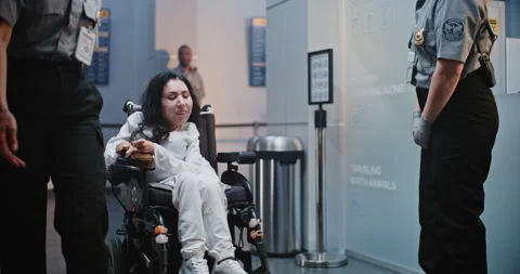 Security Checkpoint: Female TSA Officer Checking Woman with Physical Disability Stock Footage 307120914