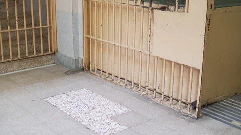 Security checkpoint in a prison with metal bars and a video camera Видео 120091530