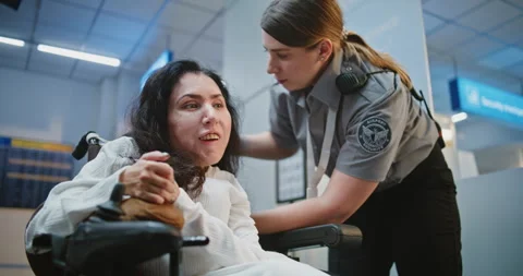 Security Checkpoint: TSA Officer Checking Female Passenger with Physical Stock Footage 307117290