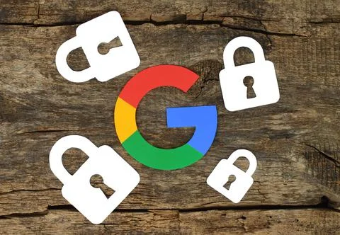 Security concept with Google icon and locks printed on paper and placed on ol Stock Photos