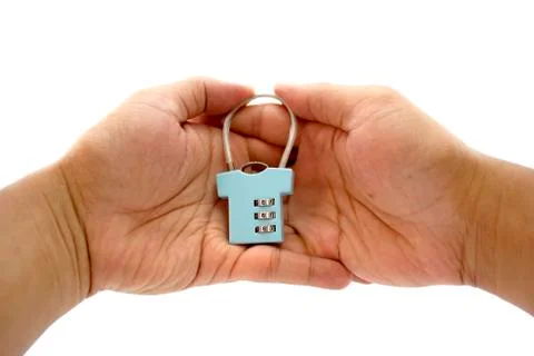 Security concept with locked-key on 2 hands. Stock Photos