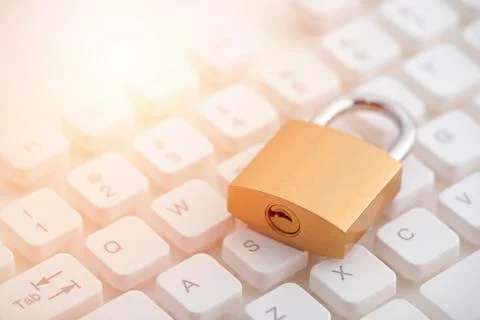 Security concept with metal padlock on computer keyboard Stock Photos