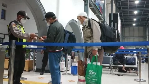 Security do the ticket Checking to passenger at yogyakarta train station Stock Footage 228896888