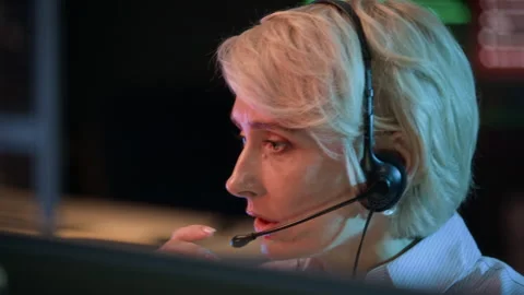 Security Engineer Providing Information via Headset in Control Center Stock Footage 334936439