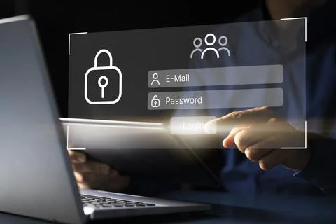 Security Expert Typing in Password to Access Secure Database on Laptop 写真素材