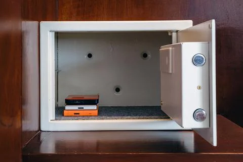 Security external hard drive in open metal safe. External hard disk containin Stock Photos