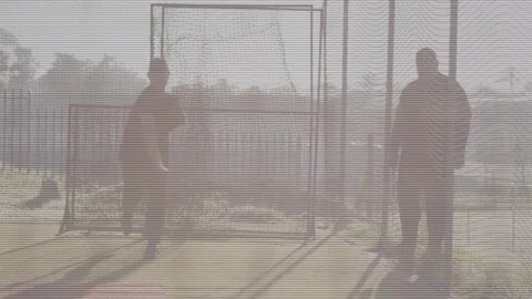 Security feed: two men on porch, left man stepping through frame after leg lift, Stock Footage 330955793