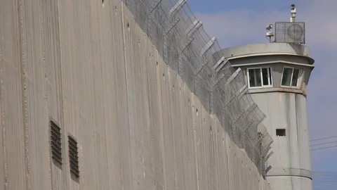 Security fence, watchtower, separation barrier wall in Bethlehem West Bank Vídeos de archivo 71486060
