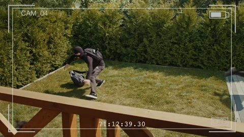 Security Footage: Guard Dog Catches Escaping Burglar in Broad Daylight Stock Footage 291941830
