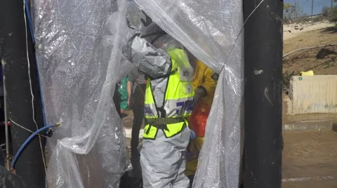  Security Forces Cleaning from Chemical attack Stock Footage 59565812